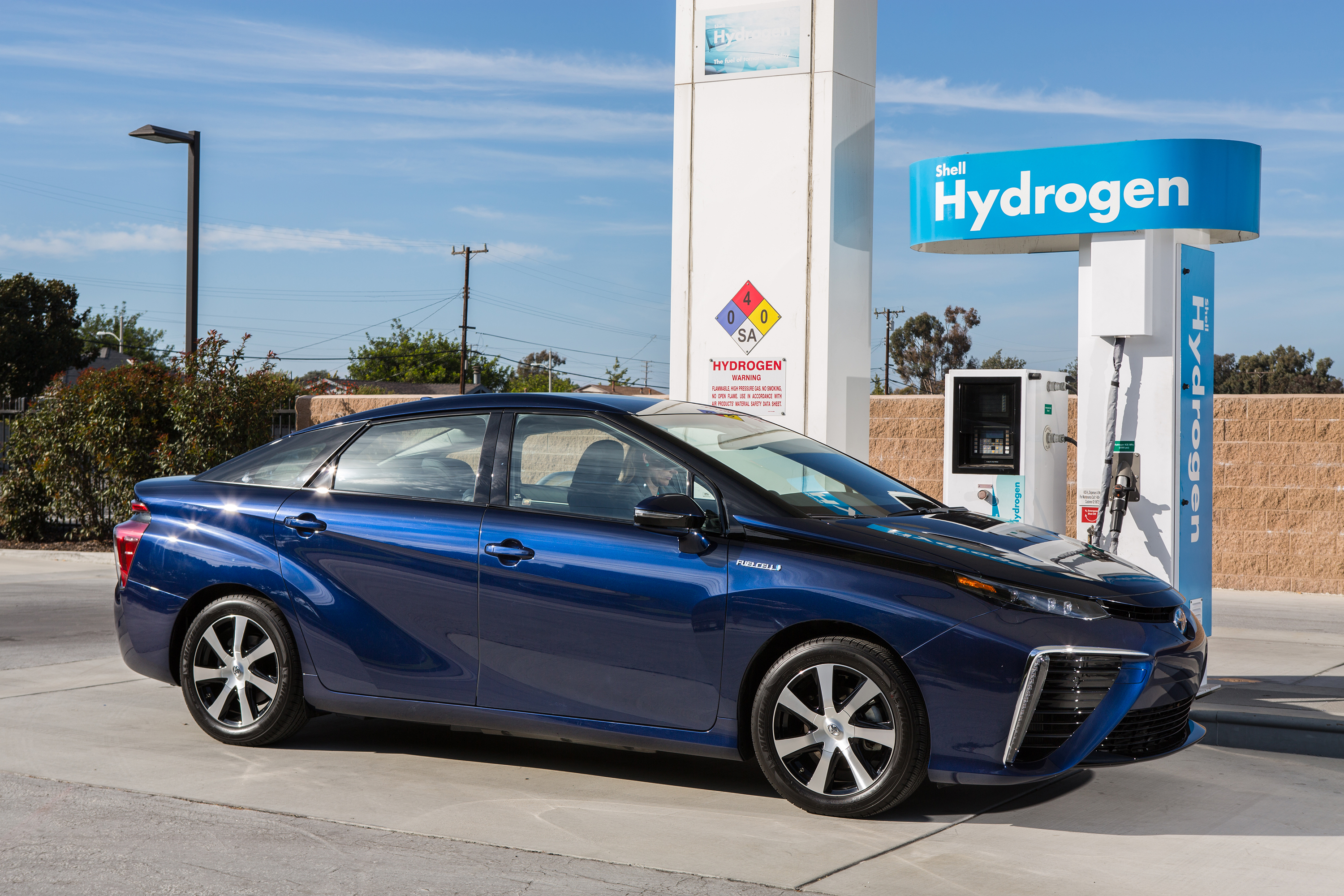 A Toyota Mirai parked at a hydrogen gas fueling station
