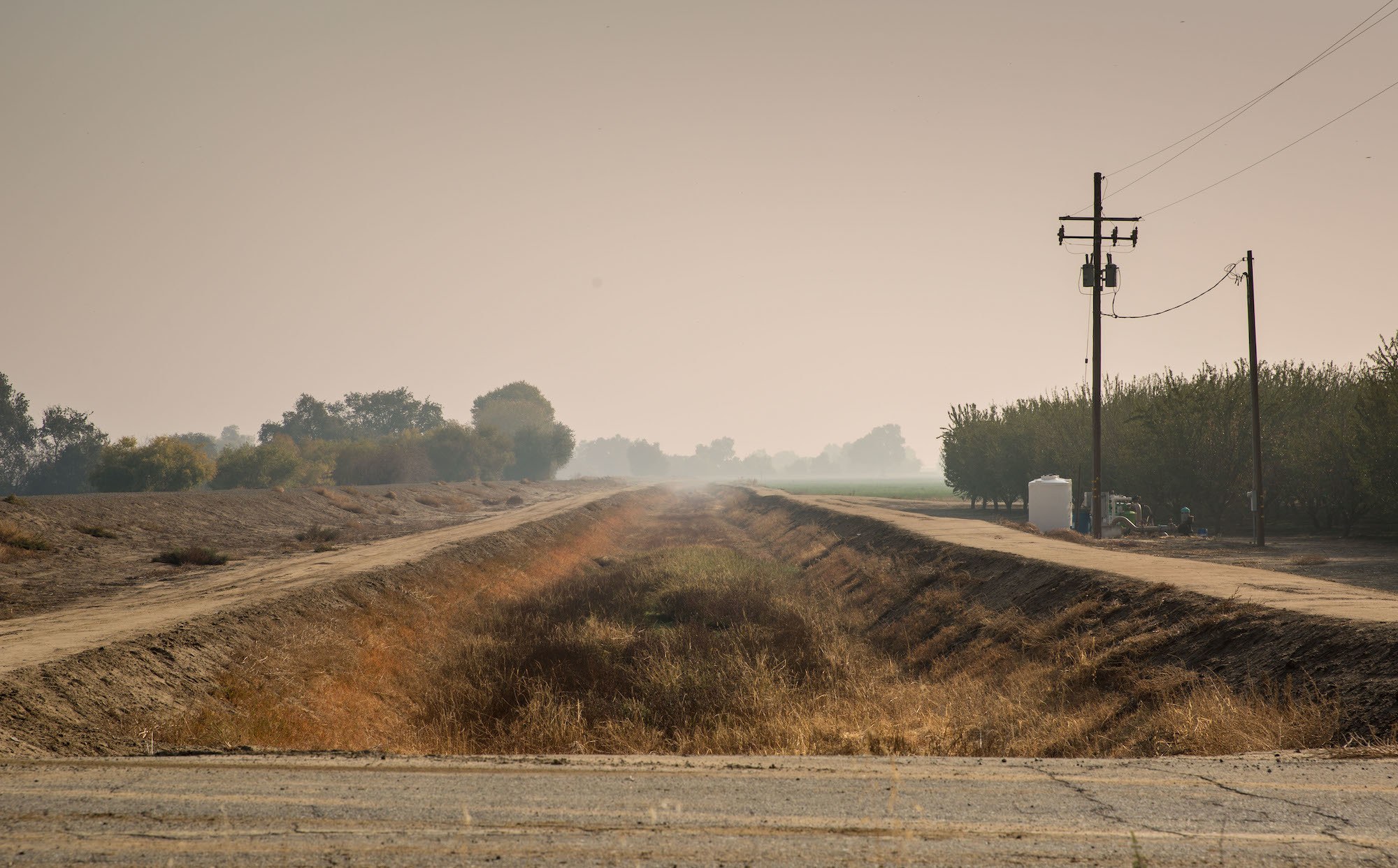A dry agricultural irrigation canal along Highway 41 is viewed on October 29, 2021, near Stratford, California. The recent record-breaking rain and snow in northern California has slowed the fire season but the state is still experiencing one of the driest and hottest periods of weather in recorded history, forcing municipalities and farmers in the Central Valley to rethink their uses of water. January 2022