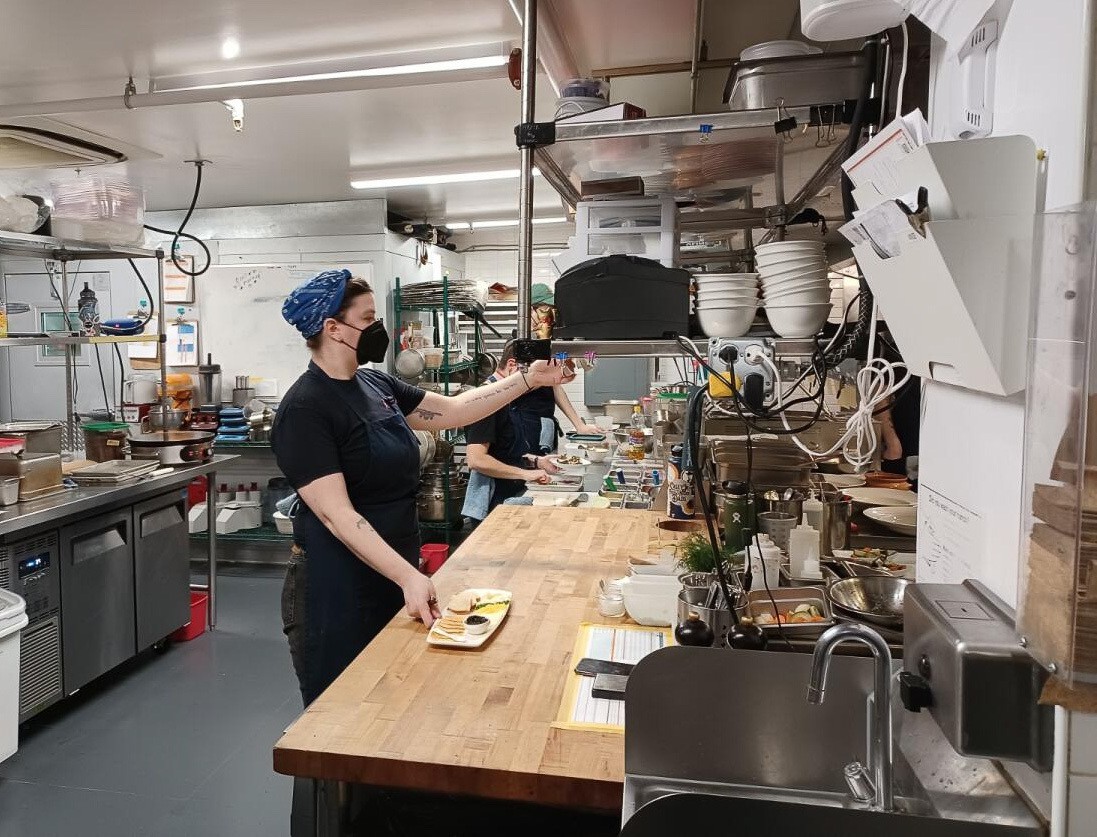 Kachka's back of house staff prepares dishes during a Friday night dinner service. Many of the dishes feature ingredients like smoked fish, rye bread and eggs. March 2022
